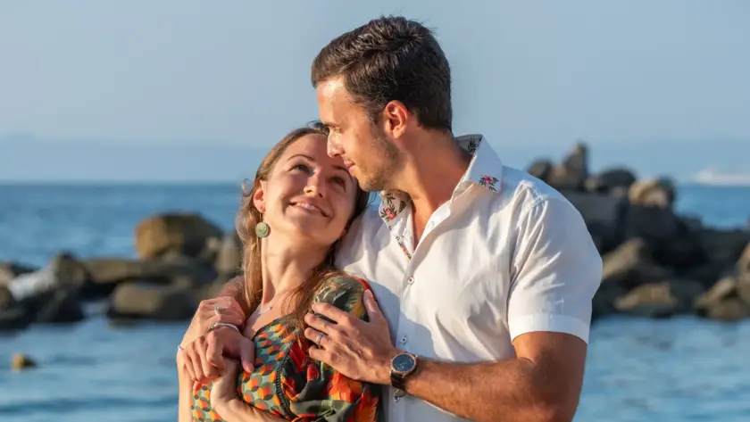 Couple embracing by the sea during a photo session in Puerto Vallarta