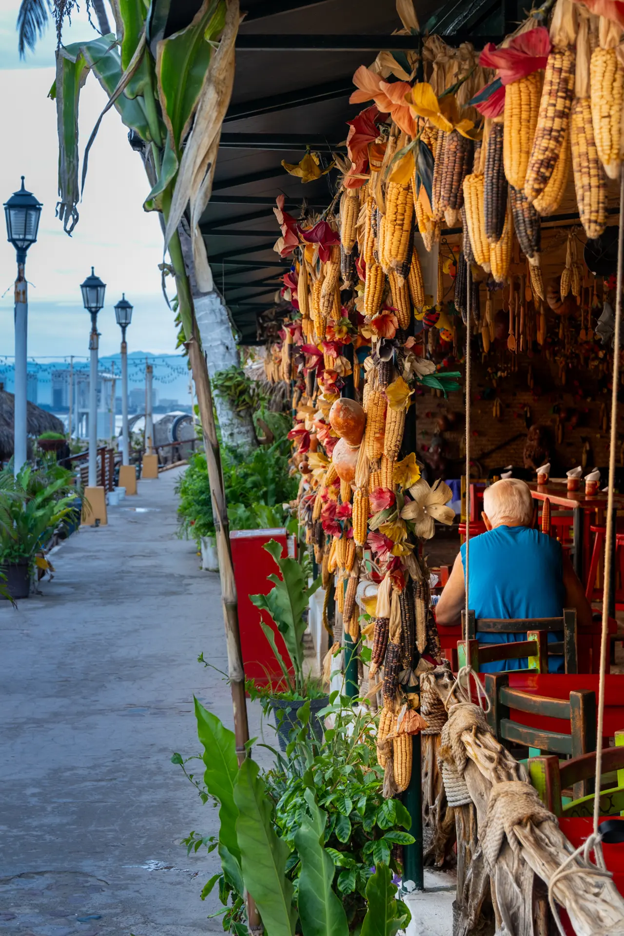 Dried corn and flowers hanging at a traditional market stall on the Puerto Vallarta waterfront